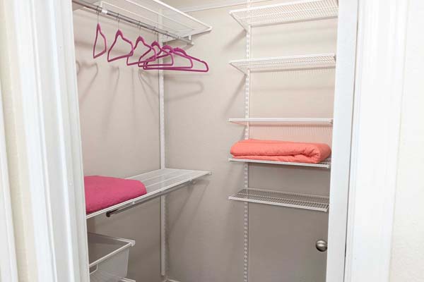 Walk-in closets with Elfa shelving.